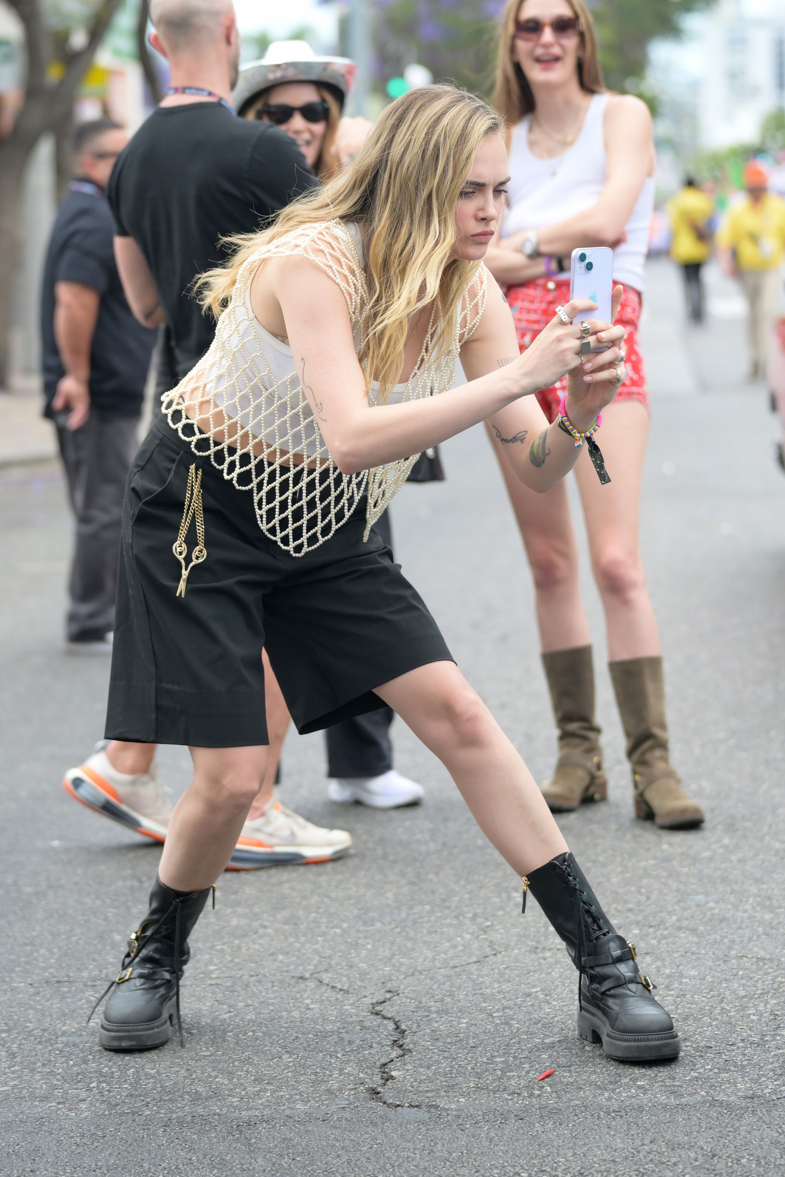 Images may contain Cara Delevingne Myléne Mackay clothing Shoes and hats finish accessories glasses jewelry and rings